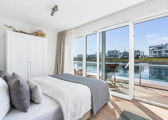 Treibholz: Meerblick, Dachterrasse, Bootsanleger, Badeleiter, Sauna Hébergement de vacances Olpenitz