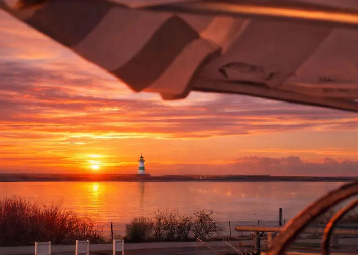 Treibholz: Meerblick, Dachterrasse, Bootsanleger, Badeleiter, Sauna Hébergement de vacances Olpenitz