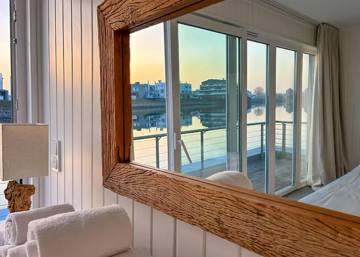 Treibholz: Meerblick, Dachterrasse, Bootsanleger, Badeleiter, Sauna Hébergement de vacances Olpenitz